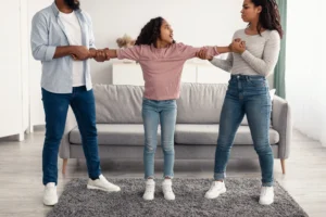 child standing between fighting parents