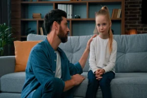 father sitting with daughter